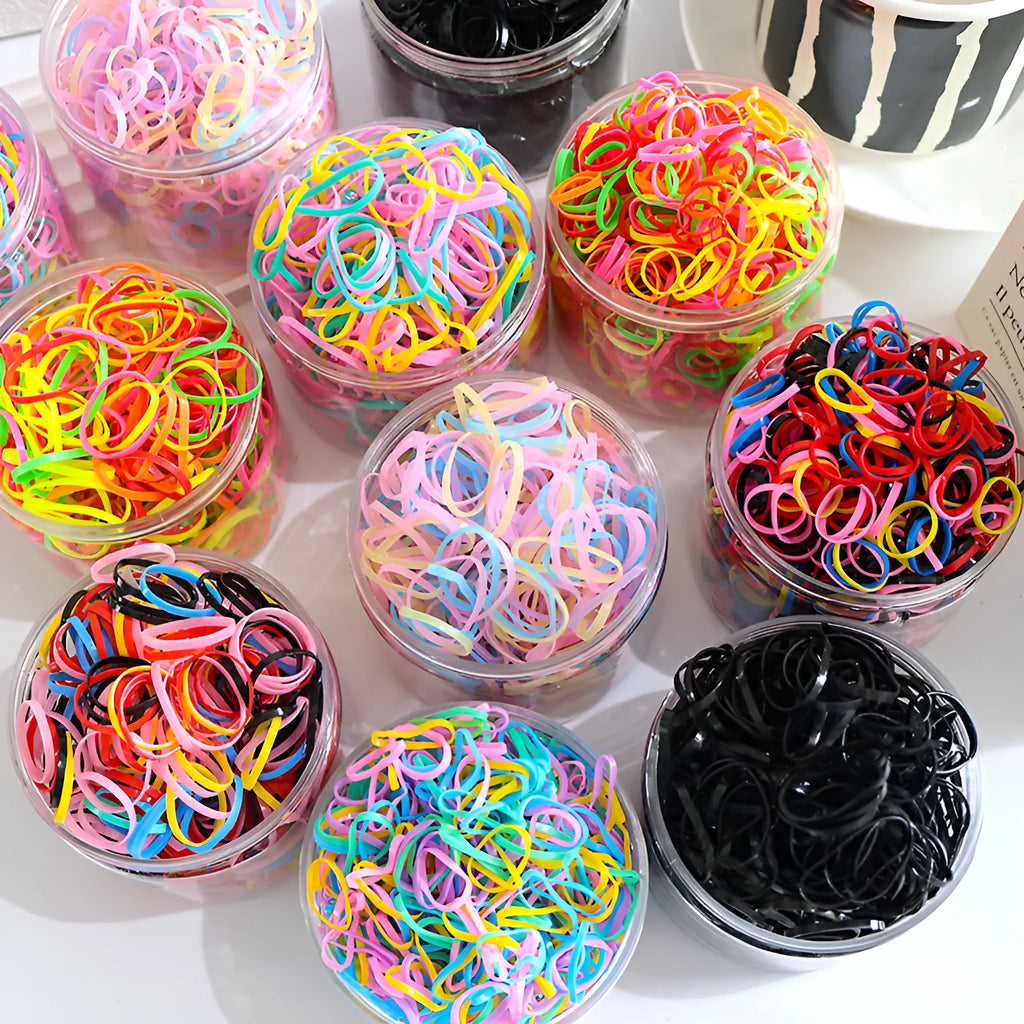 Multi-colour TPU baby hair bands in a reusable container, 300 or 600 piece pack.