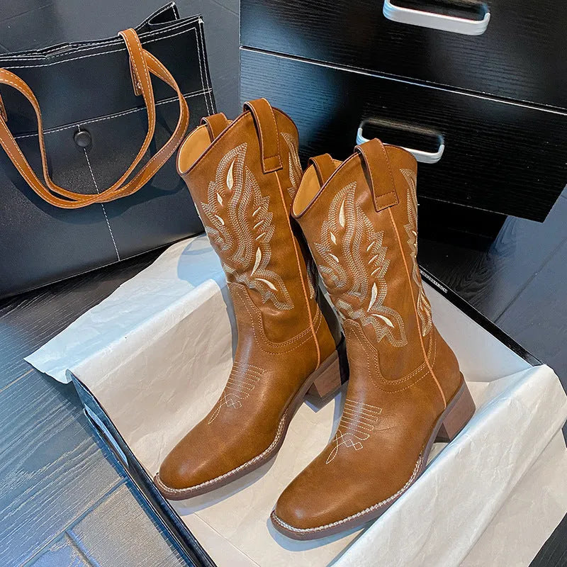 Brown women's embroidered leather Martin boots with a low square heel and mid-calf design.