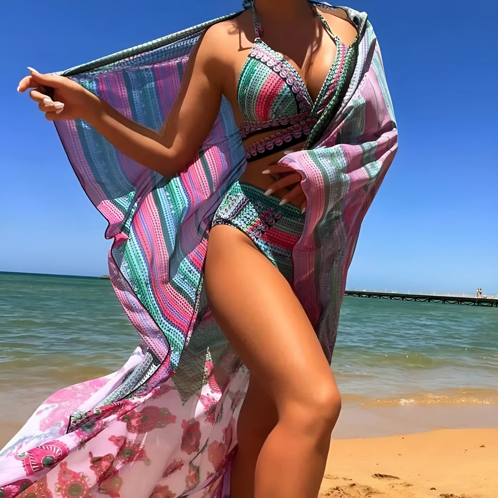 Blue women's three-piece bikini set with cross bandage front and high-waist bottoms on a mannequin.