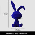 Resin table ornament of a rabbit wearing a suede blindfold with ribbon and tassel detail.