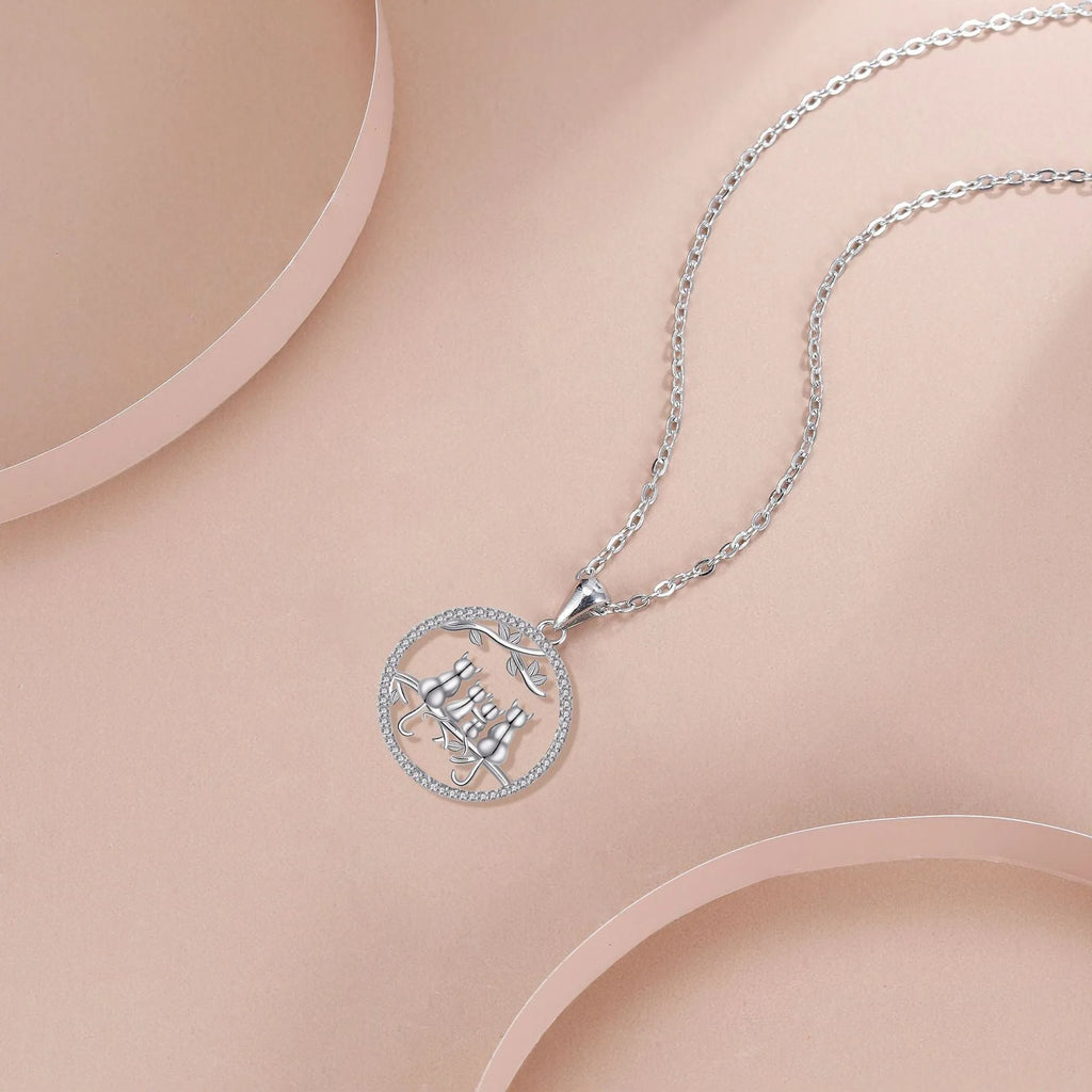 Copper necklace with four kitten pendant design and cross chain styling