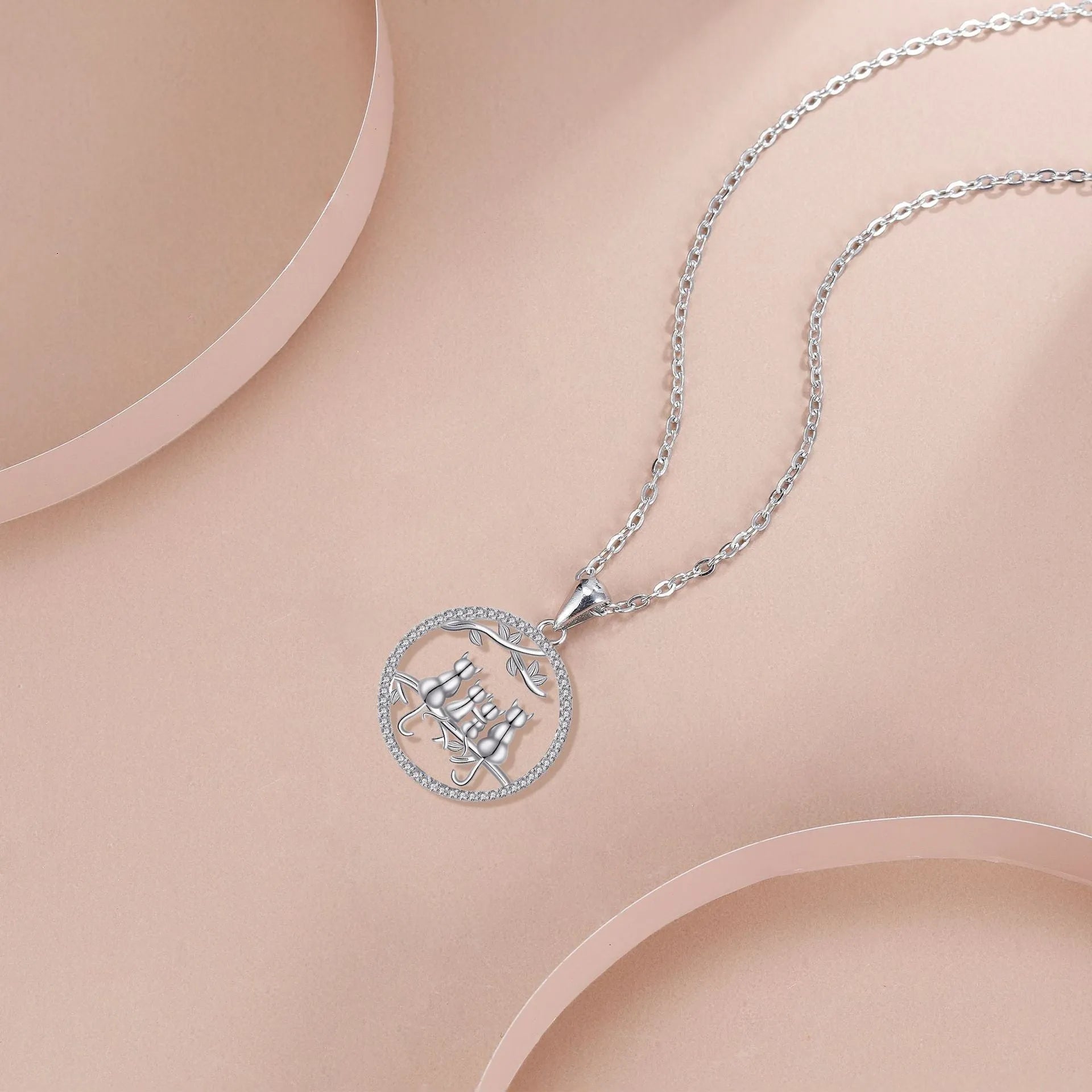 Copper necklace with four kitten pendant design and cross chain styling