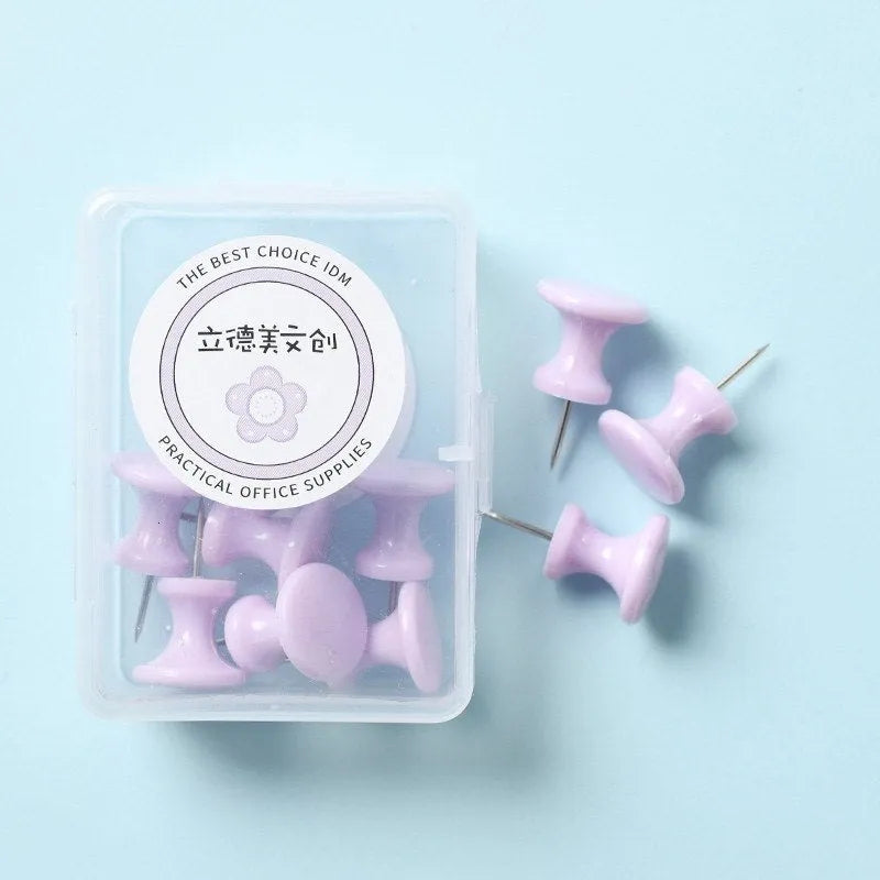 Box of colourful plastic push pins in cherry blossom pink, mint green and lavender macaron colours