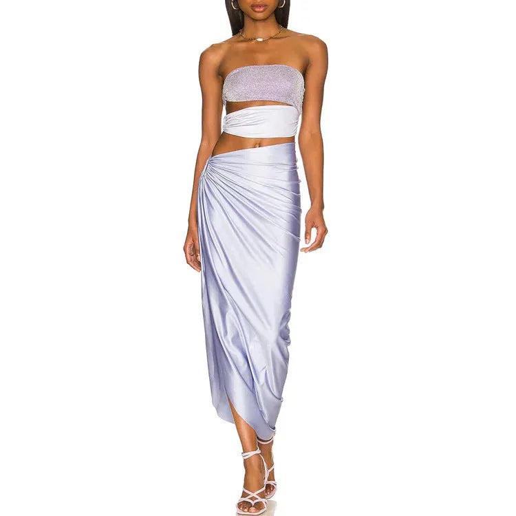 Purple hollow polyester swimsuit and matching wrap skirt set on mannequin