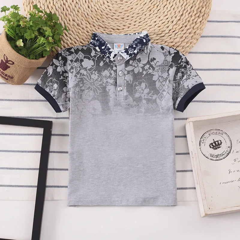 Boys' red cotton short sleeve t-shirt with a lapel collar on a hanger.