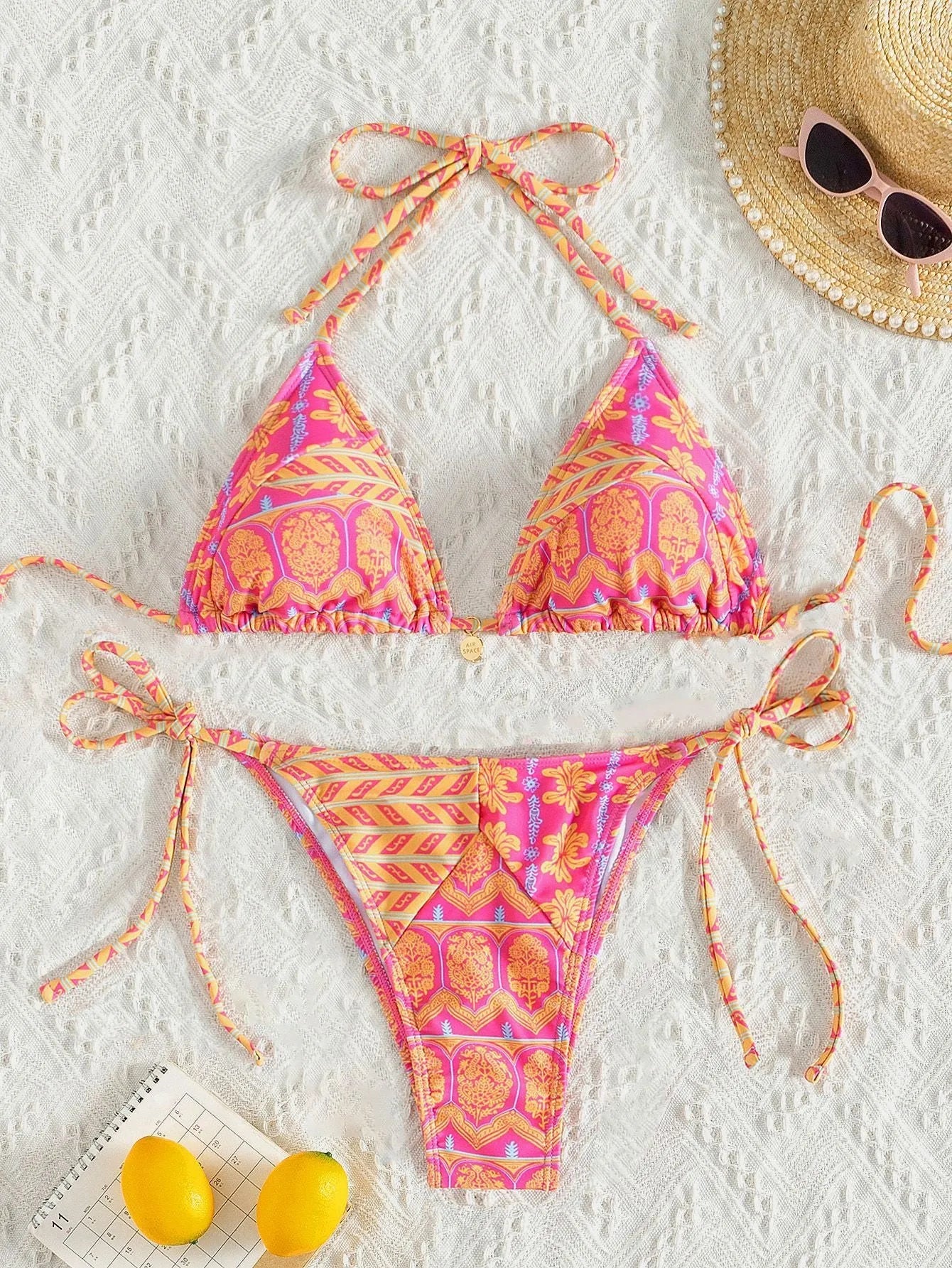 Split bikini bandage swimsuit with printing and stitching detail in polyester fabric
