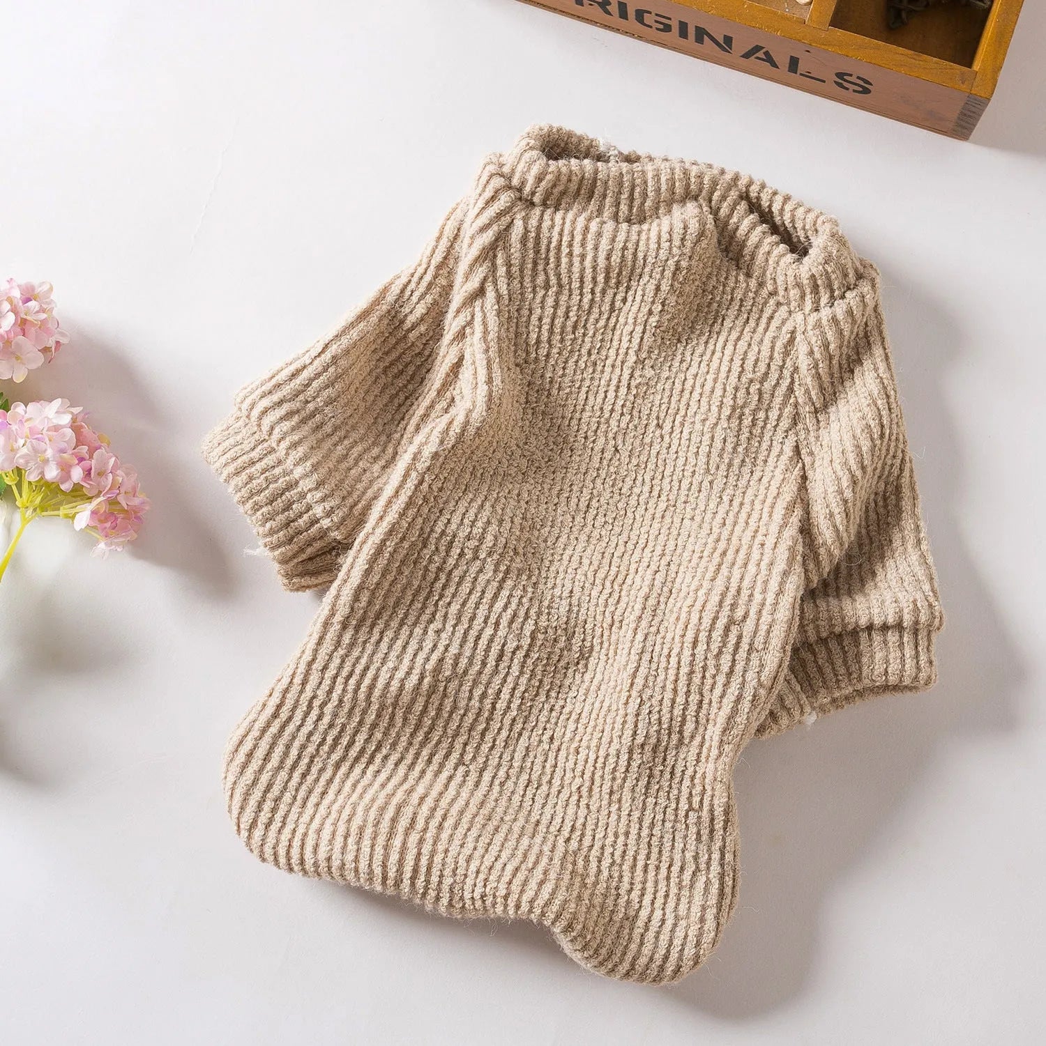 Brown cloth dog sweater pullover for small breeds on a white background.
