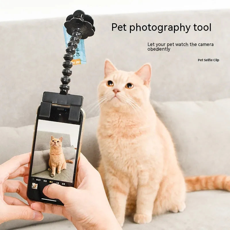 Black plastic pet photography tool with rotating clip for mobile phone attachment