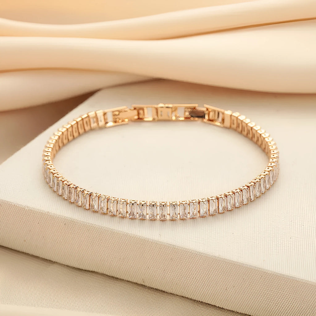 Women's brass bracelet with zircon inlaid geometric quadrilateral design in champagne gold finish