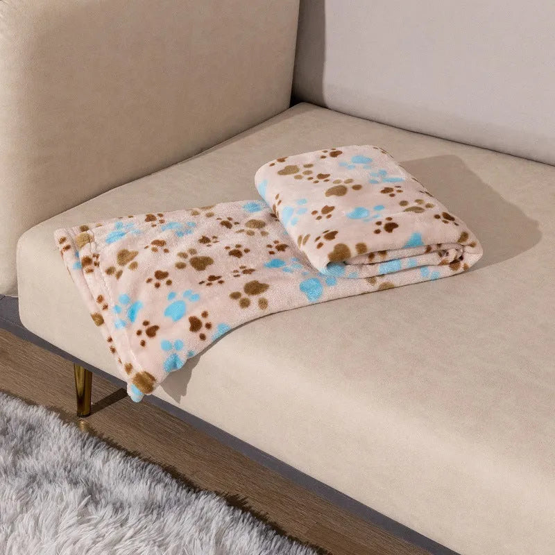 Blue cartoon dog print double-sided flannel pet blanket laid flat.