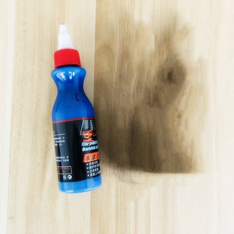 Small blue car scratch repair applicator tool with wiping sponge and repair agent bottle
