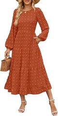 Women's long sleeve dress with ruffled sleeves and high waist in a solid colour.