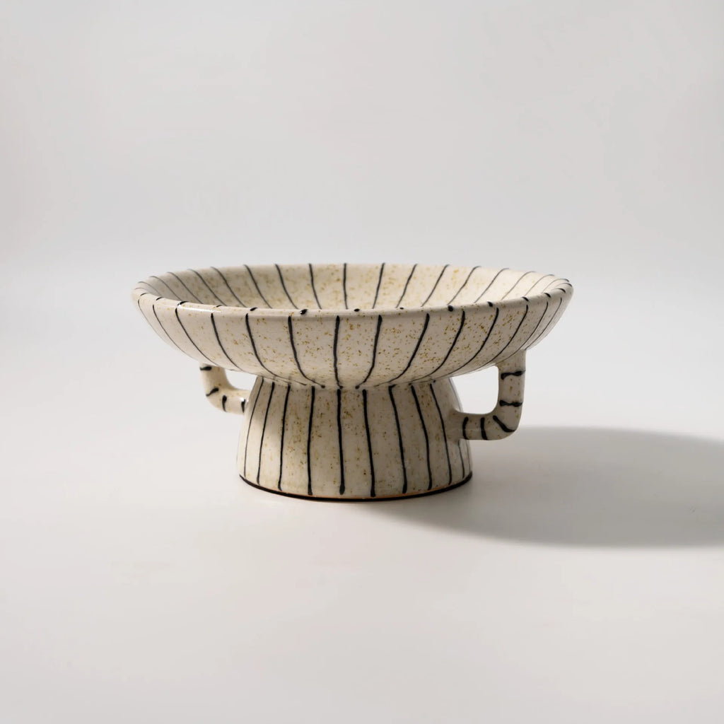 Black and white striped retro synthetic resin fruit plate ornament.