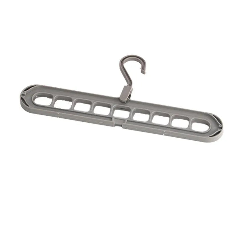Modern plastic nine-hole folding hanger for trousers in green, blue, pink, beige, or grey.