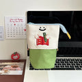 Brown Korean-style collapsible pencil case with Oxford fabric construction showing 17cm by 14cm dimensions