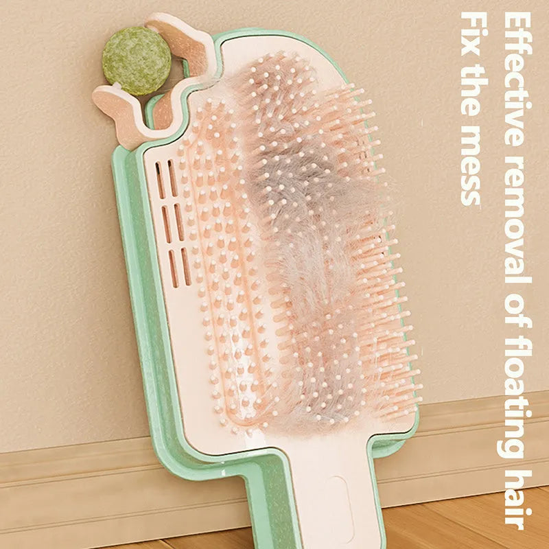 Ice cream cone shaped cat grooming toy with mint ball and feather attachment.