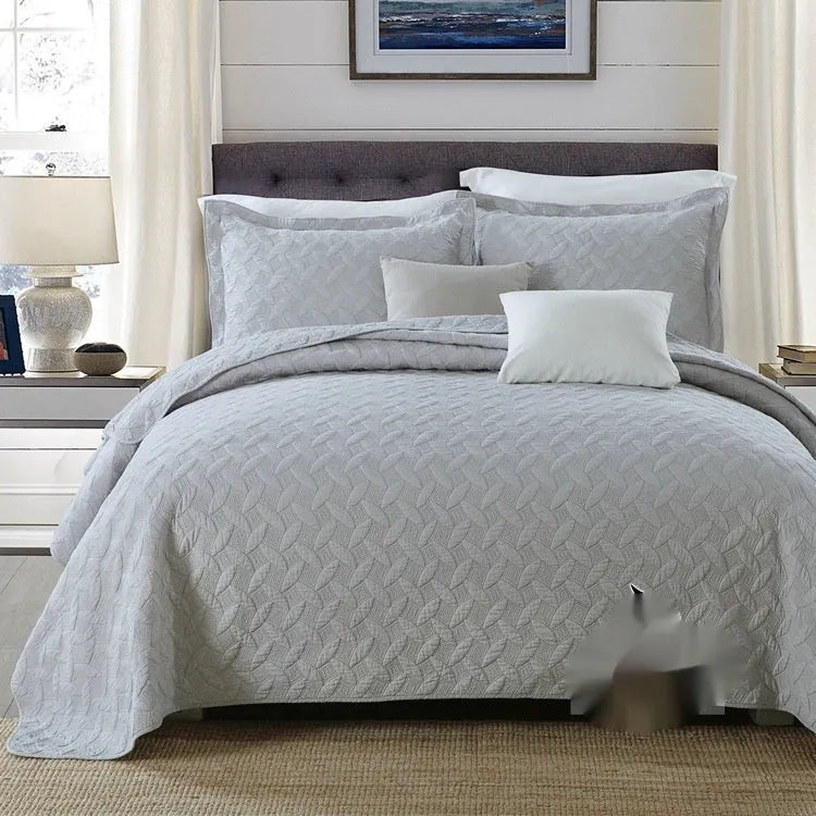 Pure cotton bedding set with damascus pattern showing embroidery details and quilted finish on bed