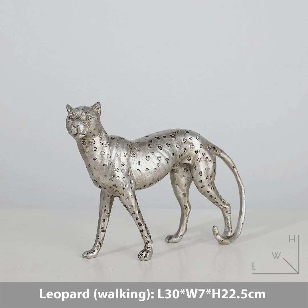 Leopard-shaped resin home ornament in American Leopard colour on wooden surface