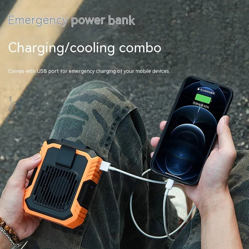 Green wrist-mounted portable fan with USB charging port, LED light, and adjustable strap.