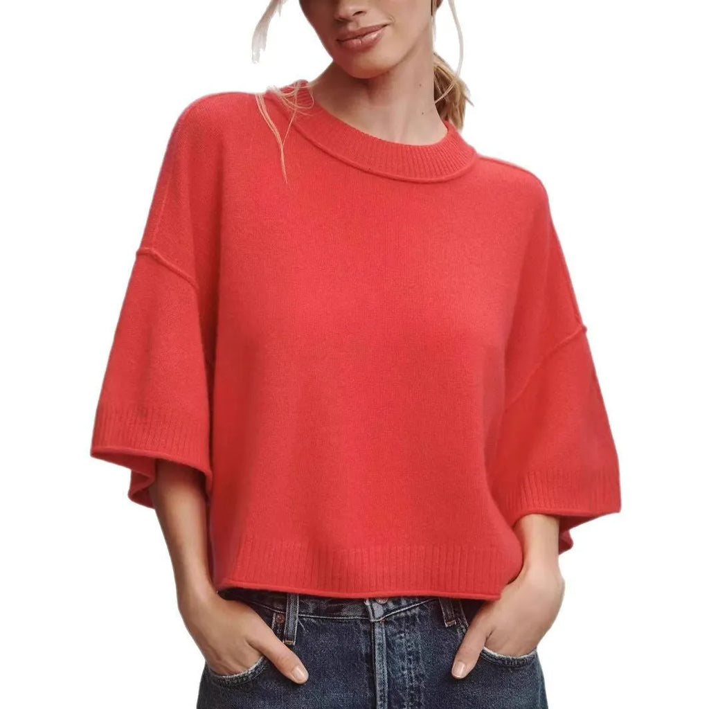 Red short sleeve viscose t-shirt with a cropped, exposed navel hem on a mannequin.