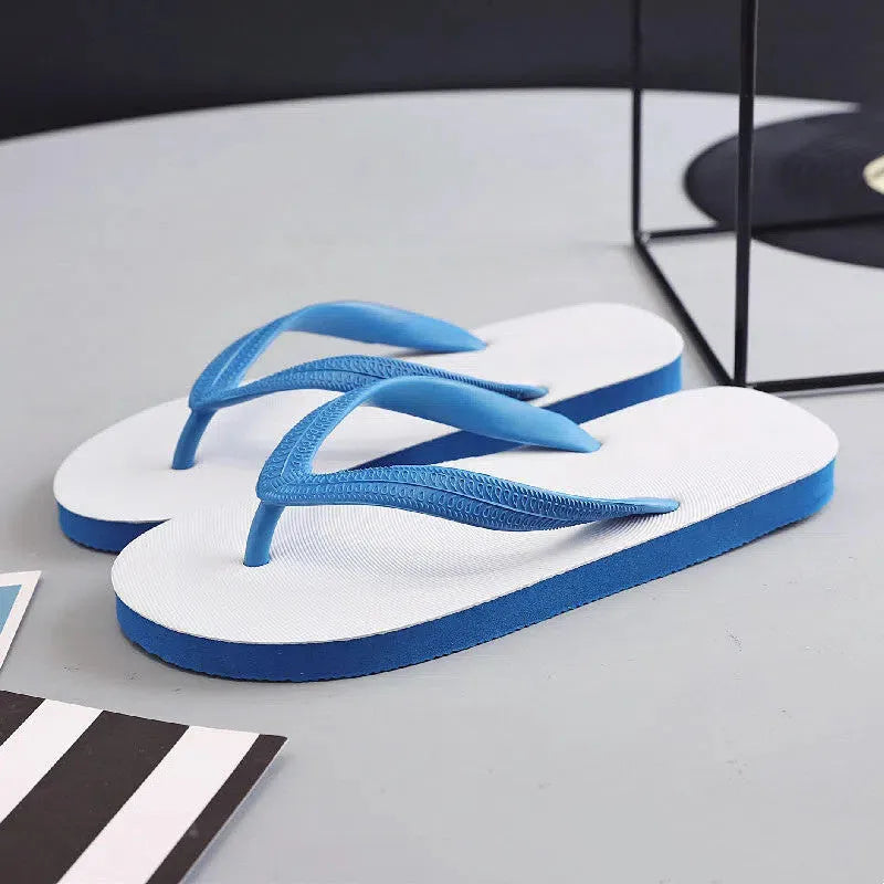 Rubber flip-flops with fish label branding in green, red, blue, and black colours showing non-slip sole