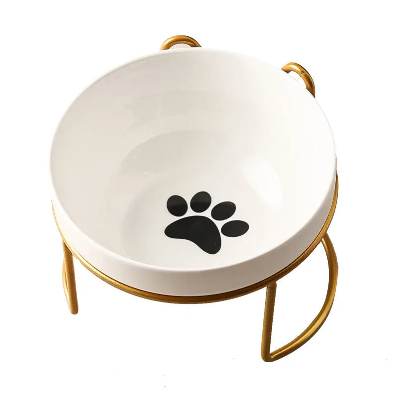 White ceramic cat bowl with decorative iron frame in cat footprints pattern