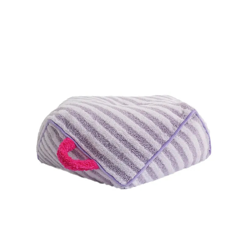 Striped orange plush fabric dog bed with a removable cover.