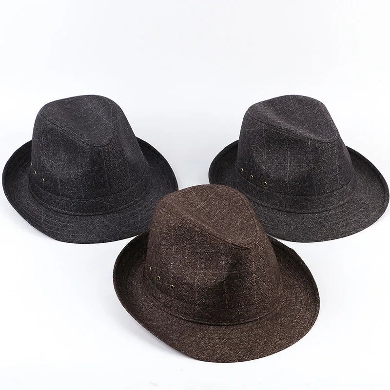 A classic fedora hat for men in thickened suit material, shown in a neutral colour on a stand.