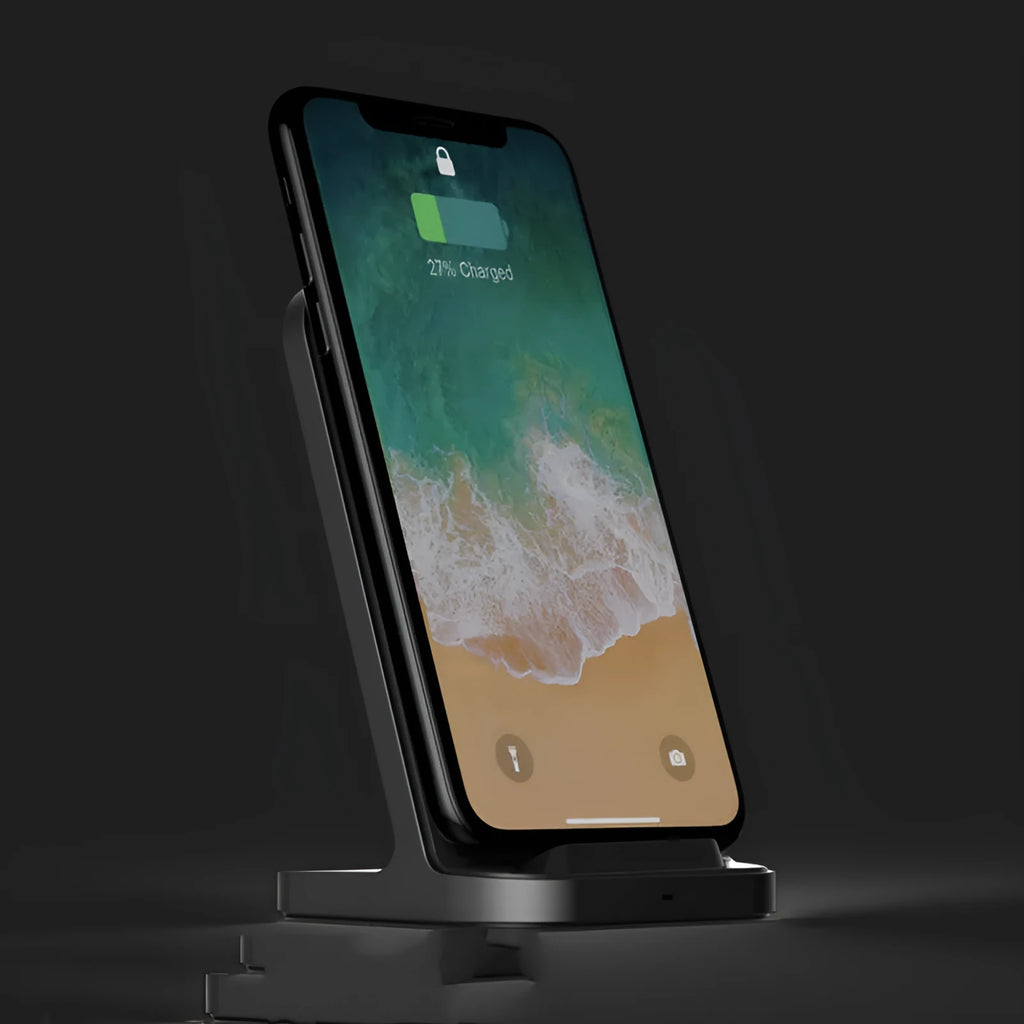 Dark grey vertical wireless charging stand for Apple iPhone on desk