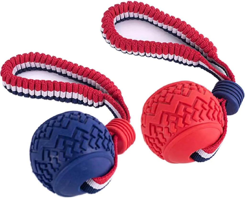 Blue or red natural rubber dog ball with attached rope for tug-of-war and teeth cleaning