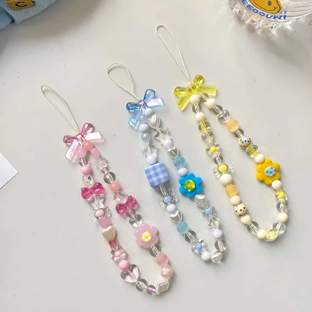 Beaded flower mobile phone lanyard with plastic resin decoration in blue, pink or yellow colours