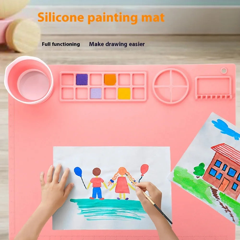 Silicone double bowl painting mat for watercolour art in various colours on a table