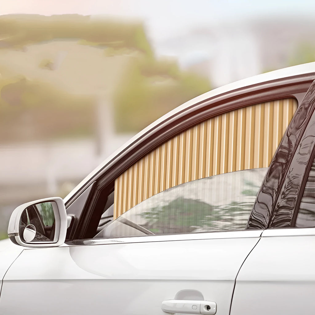 Retractable car sun curtain extended across windscreen with roller shutter mechanism visible.