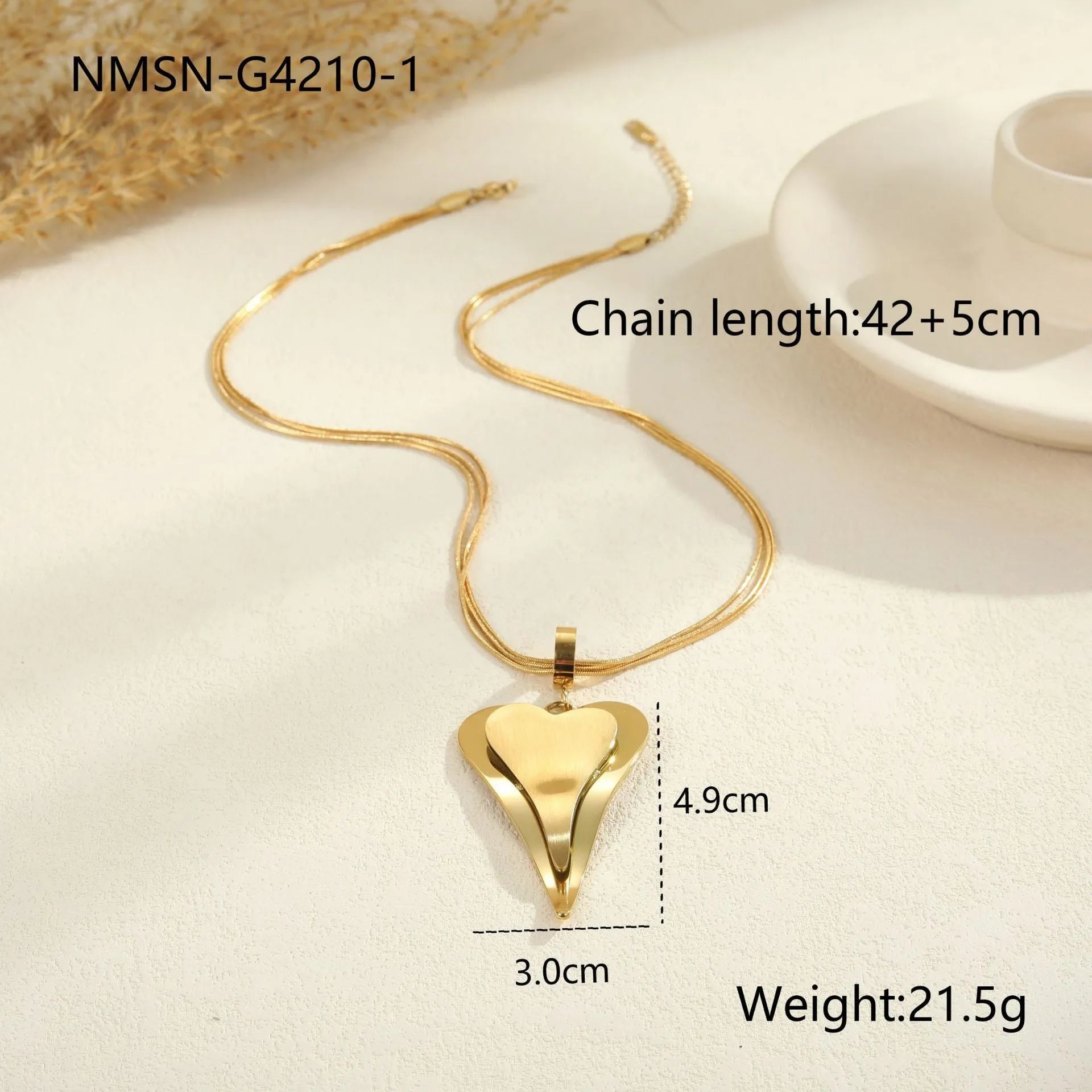 Geometric double-heart pendant on a stainless steel snake bones chain necklace for women, shown in gold and steel finishes.