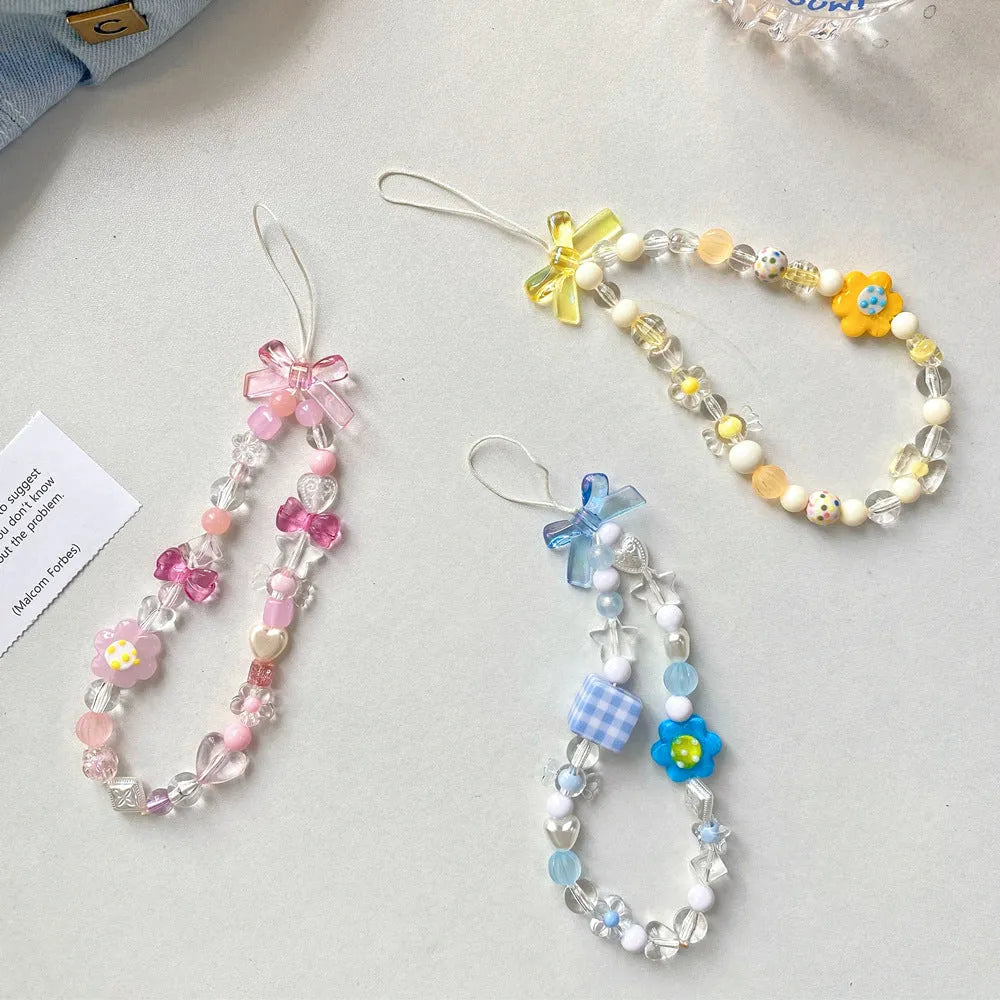 Beaded flower mobile phone lanyard with plastic resin decoration in blue, pink or yellow colours