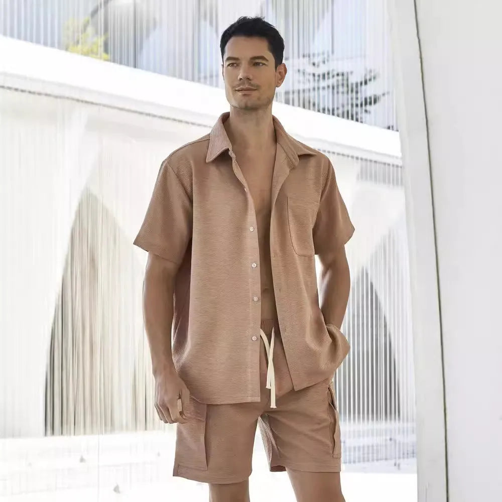 Beige polyester two-piece set with a short sleeve top and elastic waist shorts on a hanger