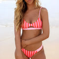 Women's polyester bikini swimsuit with choice of black and white dots or red and white stripes pattern