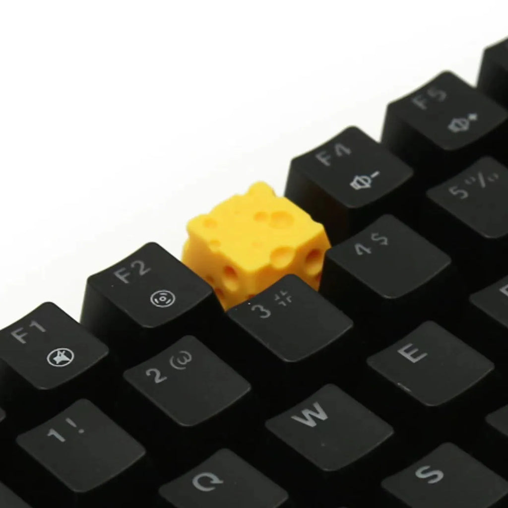 Resin cheese key cap for mechanical keyboards with yellow decorative cheese wedge design
