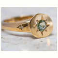 Gold-coloured star-shaped ring with oval zircon detail and adjustable opening