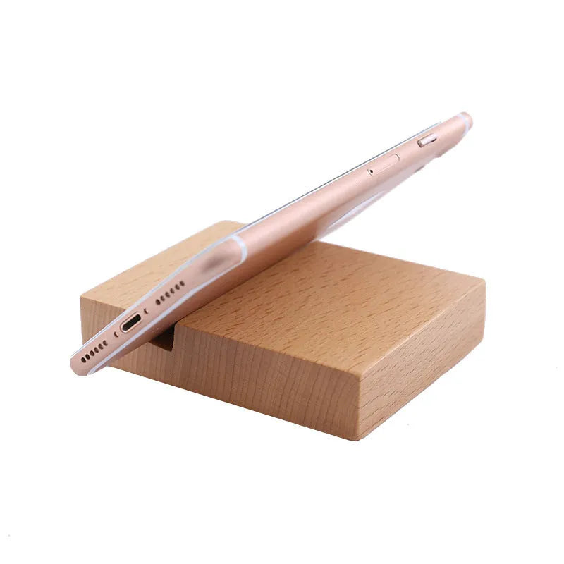 Solid beech wood mobile phone stand with a decorative resin animal ornament and a coin slot.