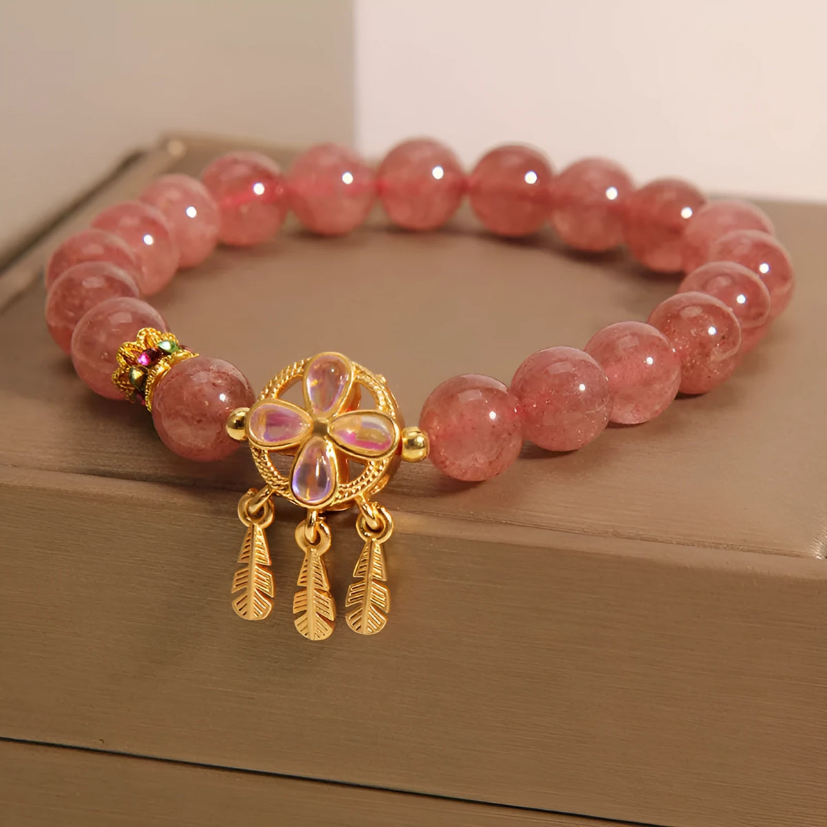 Women's strawberry quartz crystal bracelet with four-leaf clover dream catcher pendant