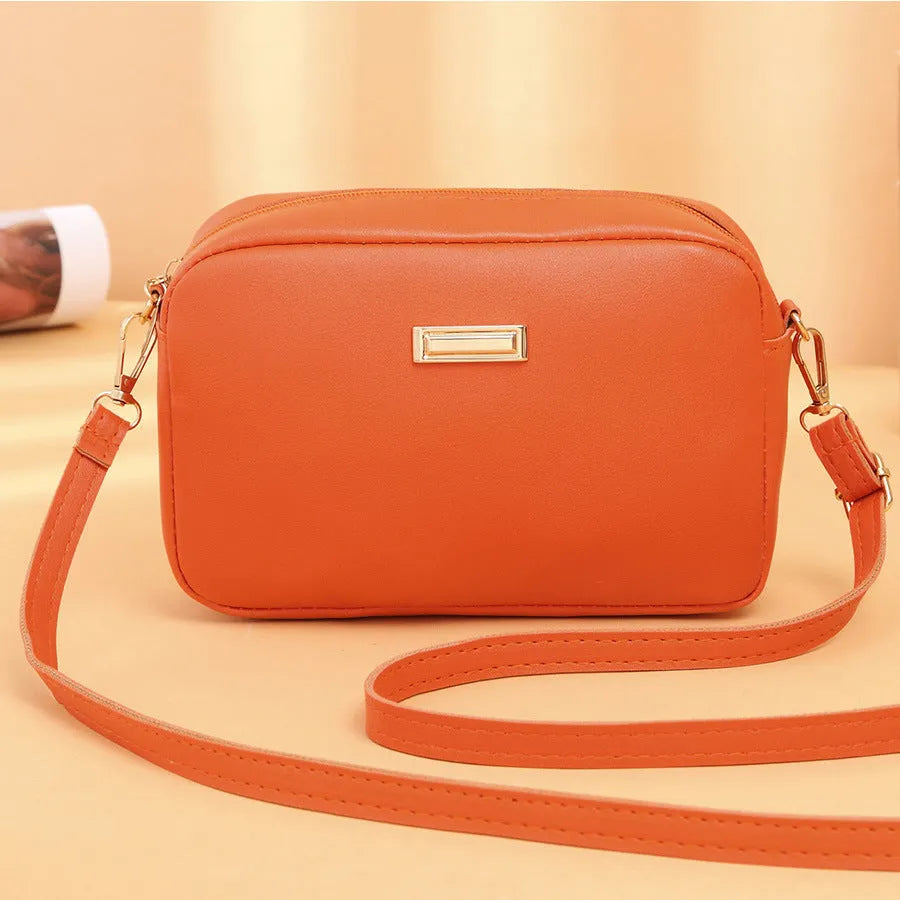 Women's solid colour PU shoulder bag with three-dimensional pocket in urban simplicity design