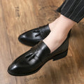 Men's black slip-on business casual shoes with tassel detail and rubber soles