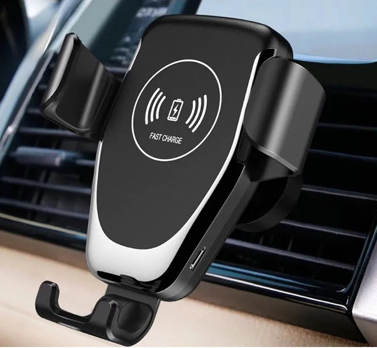 Black wireless car charger with automatic clamp mounted on vehicle vent holding Apple iPhone