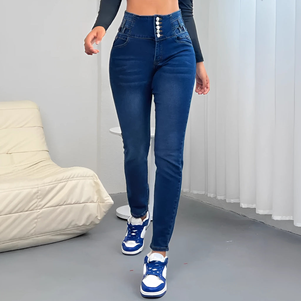 Women's dark blue straight-leg denim jeans with a breasted waist button detail.