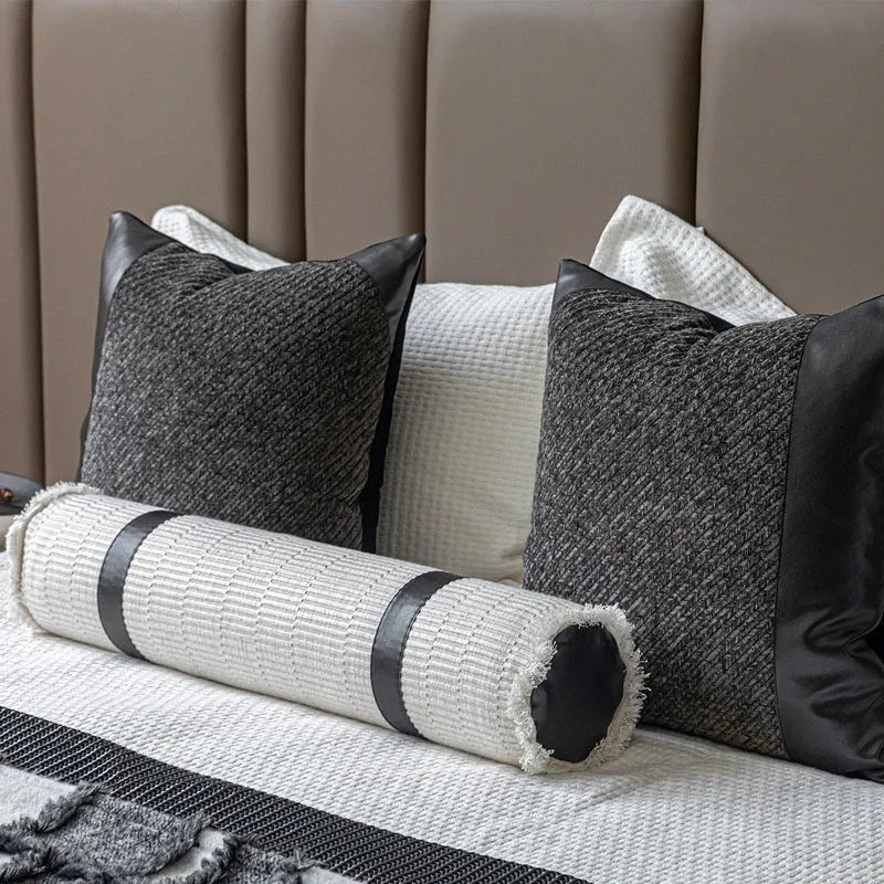 Modern minimalist bed runner set with blanket, pillowcase and leather round pillow on bed