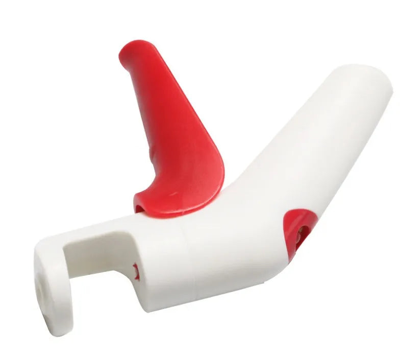 Stainless steel cherry pitter kitchen gadget with soft grip handles for removing stones from fruit.
