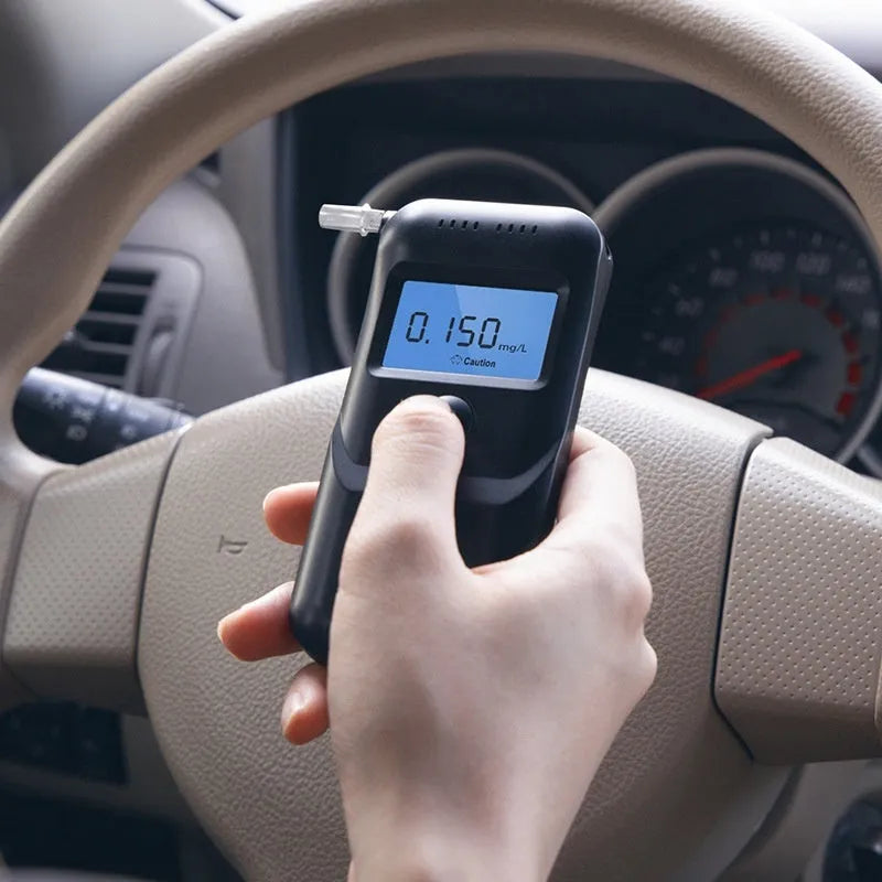 Black household alcohol tester with breath checking and height detection functions