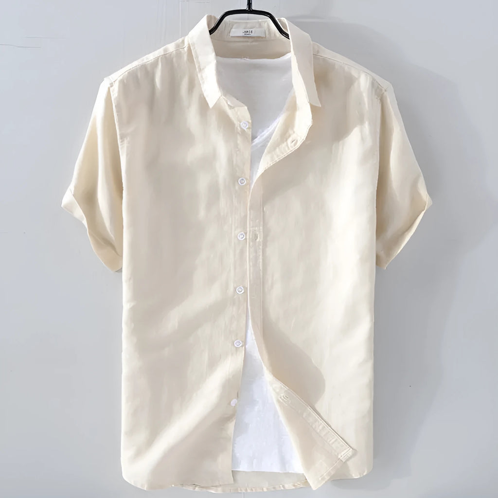 Men's loose fit short sleeve linen blend shirt in a solid colour, shown on a hanger.