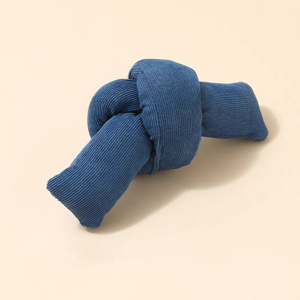White knotted cotton rope dog toy for chewing and tug-of-war play.